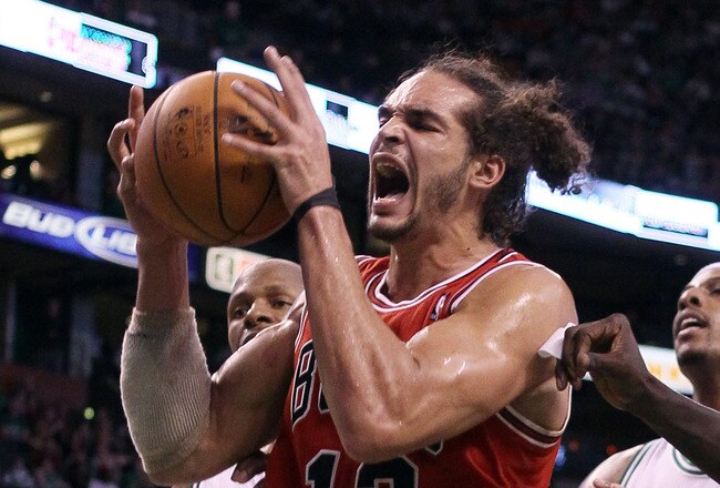 BOSTON, MA - JANUARY 13:  Joakim Noah #13 of the Chicago Bulls celebrates a basket in the fourth quarter against the Boston Celtics on January 13, 2012 at TD Garden in Boston, Massachusetts. The Chicago Bulls defeated the Boston Celtics 79-88. NOTE TO USER: User expressly acknowledges and agrees that, by downloading and or using this photograph, User is consenting to the terms and conditions of the Getty Images License Agreement.  (Photo by Elsa/Getty Images)