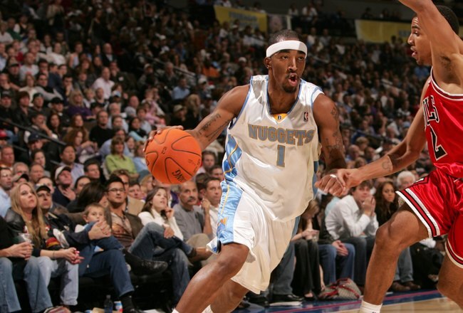 DENVER - NOVEMBER 21:  J.R. Smith #1 of the Denver Nuggets is defended by Thabo Sefolosha #2 of the Chicago Bulls during the game on November 21, 2006 at the Pepsi Center in Denver, Colorado. The Nuggets defeated the Bulls 113-109. NOTE TO USER: User expressly acknowledges and agrees that, by downloading and or using this photograph, user is consenting to the term and conditions of the Getty Images License Agreement. (Photo by Doug Pensinger/Getty Images)