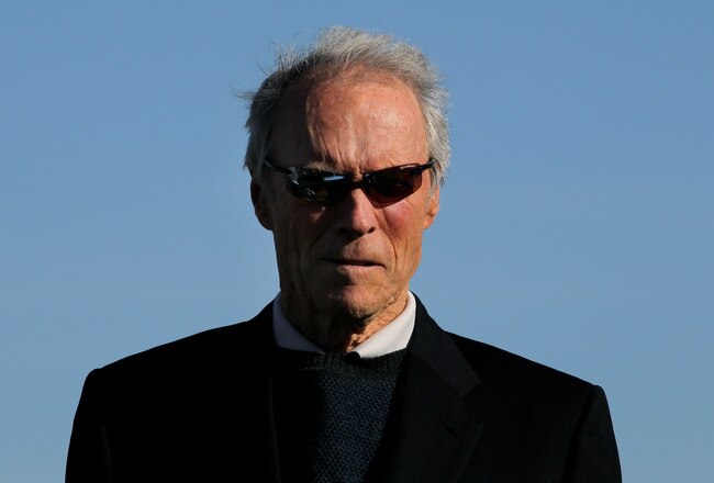 PEBBLE BEACH, CA - FEBRUARY 14:  Clint Eastwood waits on the 18th green to present the trophy during the final round of the AT&T Pebble Beach National Pro-Am at Pebble Beach Golf Links on February 14, 2010 in Pebble Beach, California. (Photo by Stephen Dunn/Getty Images)