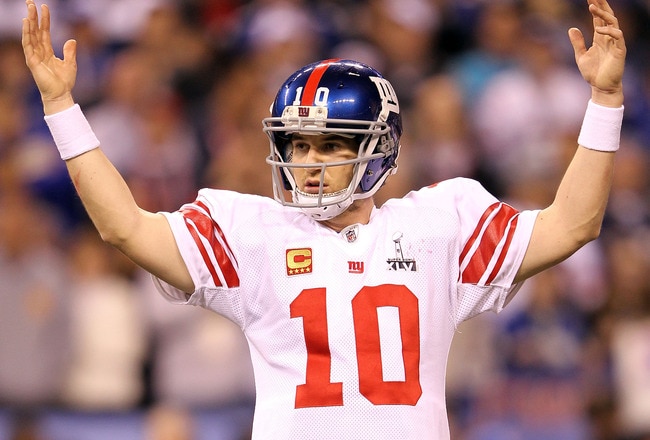 INDIANAPOLIS, IN - FEBRUARY 05:  Quarterback Eli Manning #10 of the New York Giants celebrates after Runningback Ahmad Bradshaw #44 ran the ball for a 6 yard touchdown in the fourth quarter against the New England Patriots during Super Bowl XLVI at Lucas Oil Stadium on February 5, 2012 in Indianapolis, Indiana.  (Photo by Jamie Squire/Getty Images)