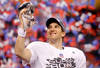 INDIANAPOLIS, IN - FEBRUARY 05:  Quarterback Eli Manning #10 of the New York Giants poses with the Vince Lombardi Trophy after the Giants defeated the Patriots by a score of 21-17 in Super Bowl XLVI at Lucas Oil Stadium on February 5, 2012 in Indianapolis, Indiana.  (Photo by Rob Carr/Getty Images)