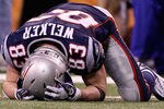 INDIANAPOLIS, IN - FEBRUARY 05:  Wes Welker #83 of the New England Patriots lays on the ground in the fourth quarter during Super Bowl XLVI at Lucas Oil Stadium on February 5, 2012 in Indianapolis, Indiana.  (Photo by Elsa/Getty Images)