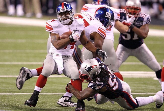 INDIANAPOLIS, IN - FEBRUARY 05:  Runningback Ahmad Bradshaw #44 of the New York Giants runs the ball in the first quarter against the New England Patriots during Super Bowl XLVI at Lucas Oil Stadium on February 5, 2012 in Indianapolis, Indiana.  (Photo by Andy Lyons/Getty Images)
