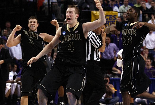 PORTLAND, OR - MARCH 21:  (C) Robbie Hummel #4 of the Purdue Boilermakers along with (L) Chris Kramer #3 and (R) E'Twaun Moore #33 celebrate after defeating the Washington Huskies during the second round of the NCAA Division I Men's Basketball Tournament at the Rose Garden on March 21, 2009 in Portland, Oregon. The Boilermakers defeated the Huskies 76-74 to advance to the Sweet 16.  (Photo by Jonathan Ferrey/Getty Images)