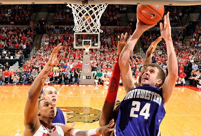 COLUMBUS, OH - DECEMBER 28:  John Shurna #24 of the Northwestern Wildcats attempts a shot underneath the basket as Jared Sullinger #0 of the Ohio State Buckeyes defends on December 28, 2011 at Value City Arena in Columbus, Ohio. Ohio State defeated Northwestern 87-54.   (Photo by Jamie Sabau/Getty Images)