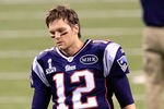 INDIANAPOLIS, IN - FEBRUARY 05:  Quarterback Tom Brady #12 of the New England Patriots walks on the field prior to Super Bowl XLVI against the New York Giants at Lucas Oil Stadium on February 5, 2012 in Indianapolis, Indiana.  (Photo by Chris Trotman/Getty Images)