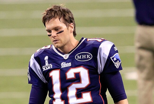 INDIANAPOLIS, IN - FEBRUARY 05:  Quarterback Tom Brady #12 of the New England Patriots walks on the field prior to Super Bowl XLVI against the New York Giants at Lucas Oil Stadium on February 5, 2012 in Indianapolis, Indiana.  (Photo by Chris Trotman/Getty Images)