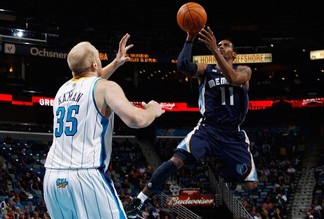 NEW ORLEANS, LA - JANUARY 18:  Mike Conley #11 of the Memphis Grizzlies shoots the ball over Chris Kaman #35 of the New Orleans Hornets at New Orleans Arena on January 18, 2012 in New Orleans, Louisiana.  NOTE TO USER: User expressly acknowledges and agrees that, by downloading and or using this photograph, User is consenting to the terms and conditions of the Getty Images License Agreement.  (Photo by Chris Graythen/Getty Images)