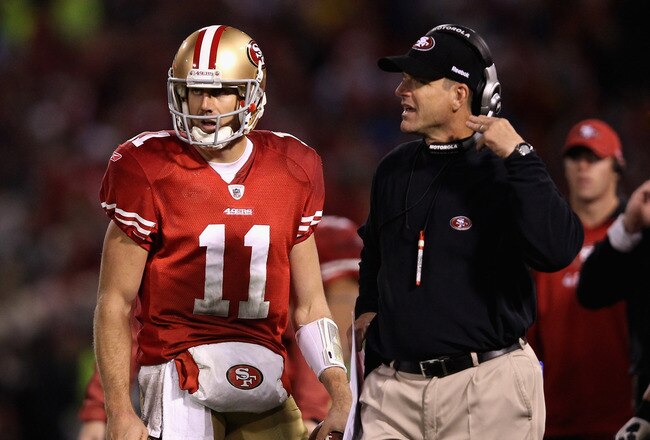SAN FRANCISCO, CA - JANUARY 22:  Alex Smith #11 of the San Francisco 49ers stands with head coach Jim Harbaugh of the San Francisco 49ers
during the fourth quarter of the NFC Championship Game against the New York Giants at Candlestick Park on January 22, 2012 in San Francisco, California.  (Photo by Ezra Shaw/Getty Images)