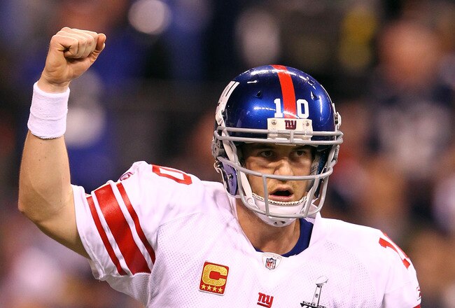 INDIANAPOLIS, IN - FEBRUARY 05:  Eli Manning #10 of the New York Giants reacts in the first half while taking on the New England Patriots during Super Bowl XLVI at Lucas Oil Stadium on February 5, 2012 in Indianapolis, Indiana. Manning, named MVP, led the Giants to a 21-17 victory.  (Photo by Al Bello/Getty Images)