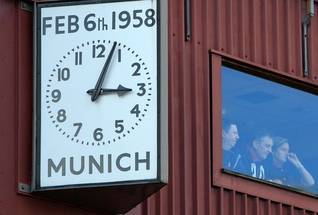 MANCHESTER, UNITED KINGDOM - FEBRUARY 06:  Manchester United staff look on from a window next to the Munich Clock during a memorial event for the 'Busby Babes' at Old Trafford on February 6, 2008 in Manchester, England. The club held a memorial events to remember the 23 people who died in an airplane crash at Munich Airport 50 years ago. Eight Manchester United players were among the dead.  (Photo by Christopher Furlong/Getty Images)