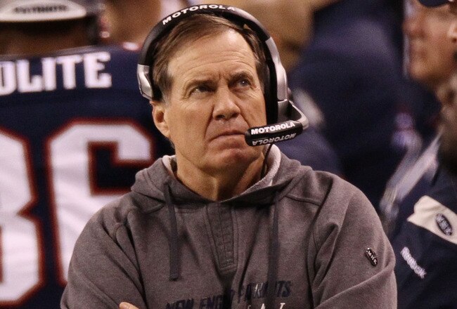 INDIANAPOLIS, IN - FEBRUARY 05:  Head coach Bill Belichick of the New England Patriots waits on the field before the New England Patriots take on the New York Giants in Super Bowl XLVI at Lucas Oil Stadium on February 5, 2012 in Indianapolis, Indiana.  (Photo by Win McNamee/Getty Images)