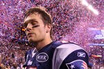 INDIANAPOLIS, IN - FEBRUARY 05:  Tom Brady #12 of the New England Patriots walks off the field after losing to the New York Giants by a score of 21-17 in Super Bowl XLVI at Lucas Oil Stadium on February 5, 2012 in Indianapolis, Indiana.  (Photo by Elsa/Getty Images)