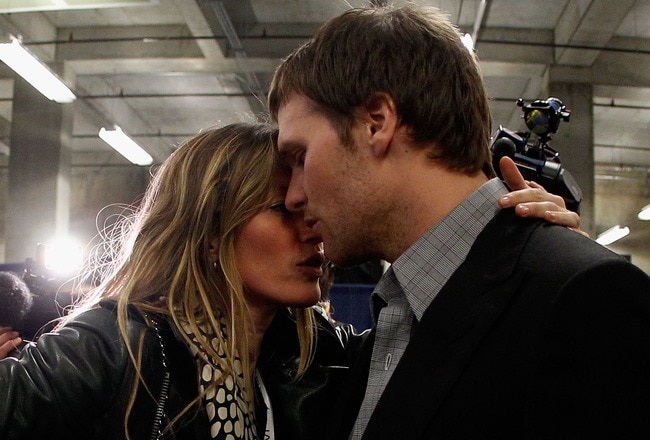 INDIANAPOLIS, IN - FEBRUARY 05:  Tom Brady #12 of the New England Patriots is comforted by his wife Gisele Bundchen after losing to the New York Giants by a score of 21-17 in Super Bowl XLVI at Lucas Oil Stadium on February 5, 2012 in Indianapolis, Indiana.  (Photo by Rob Carr/Getty Images)