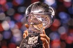 INDIANAPOLIS, IN - FEBRUARY 05:  Members of the New York Giants pose with the Vince Lombardi Trophy after the Giants defeated the Patriots by a score of 21-17 in Super Bowl XLVI at Lucas Oil Stadium on February 5, 2012 in Indianapolis, Indiana.  (Photo by Ezra Shaw/Getty Images)