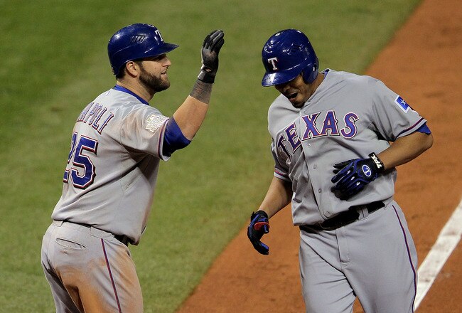 ST LOUIS, MO - OCTOBER 27: Nelson Cruz #17 (R) of the Texas Rangers celebrates with Mike Napoli #25 after hitting a solo home run in the seventh inning during Game Six of the MLB World Series against the St. Louis Cardinals at Busch Stadium on October 27, 2011 in St Louis, Missouri.  (Photo by Doug Pensinger/Getty Images)