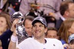 INDIANAPOLIS, IN - FEBRUARY 05:  Eli Manning #10 of the New York Giants hoist the Vince Lombardi Trophy after defeating the New England Patriots in Super Bowl XLVI at Lucas Oil Stadium on February 5, 2012 in Indianapolis, Indiana. The New York Giants defeated the New England Patriots 21-17.  (Photo by Joe Robbins/Getty Images)