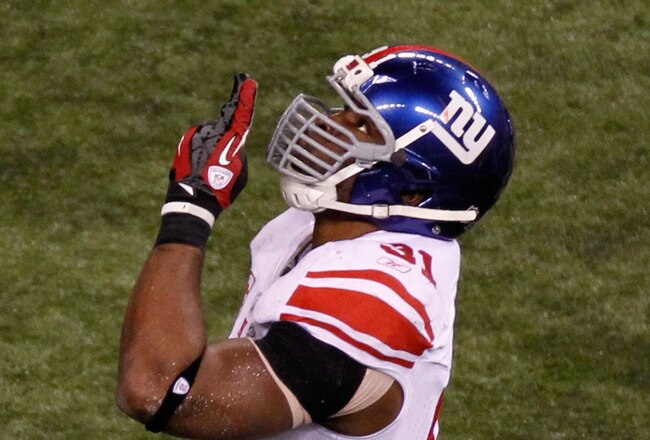 INDIANAPOLIS, IN - FEBRUARY 05:  Justin Tuck #91 of the New York Giants reacts to a sack in the fourth quarter during the game against the New England Patriots during Super Bowl XLVI at Lucas Oil Stadium on February 5, 2012 in Indianapolis, Indiana.  (Photo by Gregory Shamus/Getty Images)