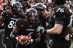 CINCINNATI, OH - DECEMBER 03:  Anthony McClung #6 of the Cincinnati Bearcats celebrates with teammates after scoring a touchdown against the Connecticut Huskies on December 3, 2011 at Nippert Stadium in Cincinnati, Ohio. Cincinnati defeated Connecticut 35-27. (Photo by Tyler Barrick/Getty Images)