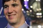 INDIANAPOLIS, IN - FEBRUARY 06:  In this General Motors handout, Eli Manning #10 of the New York Giants poses with the Super Bowl Championship Lombardi Trophy (right) and the Pete Rozelle Trophy for being the Super Bowl XLVI Most Valuable Player after defeating the New England Patriots during Super Bowl XLVI on February 6, 2012 in Indianapolis, Indiana. Manning, named MVP, led the Giants to a 21-17 victory.  (Photo by AJ Mast/General Motors via Getty Images)