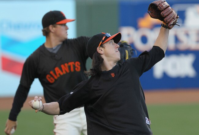 SAN FRANCISCO - OCTOBER 25:  Tim Lincecum #55 of the San Francisco Giants throws alongside teammate Matt Cain #18 during a team workout at AT&T Park on October 25, 2010 in San Francisco, California. The Giants are preparing to face the Texas Rangers in the 2010 World Series.  (Photo by Justin Sullivan/Getty Images)