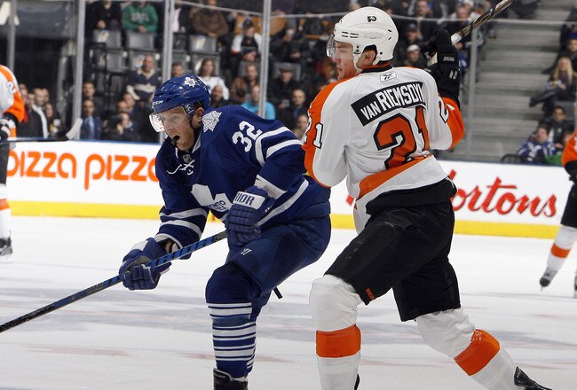 TORONTO, CANADA - DECEMBER 9: Kris Versteeg #32 of the Toronto Maple Leafs gets around James van Riemsdyk #21 of the Philadelphia Flyers during game action at the Air Canada Centre December 9, 2010 in Toronto, Ontario, Canada. (Photo by Abelimages/Getty Images)