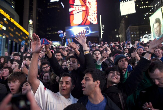 NEW YORK, NY - FEBRUARY 5: New York Giants fans celebrate defeating the New England Patriots in Super Bowl XLVI in Times Square on February 5, 2012 in New York City. The Giants also claimed a Super Bowl victory over the Patriots in 2008. (Photo by Allison Joyce/Getty Images)