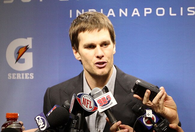 INDIANAPOLIS, IN - FEBRUARY 05:  Quarterback Tom Brady #12 of the New England Patriots speaks to the media after losing to the New York Giants in Super Bowl XLVI at Lucas Oil Stadium on February 5, 2012 in Indianapolis, Indiana. The New York Giants defeated the New England Patriots 21-17.  (Photo by Jamie Squire/Getty Images)
