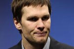 INDIANAPOLIS, IN - FEBRUARY 05:  Quarterback Tom Brady #12 of the New England Patriots speaks to the media after losing to the New York Giants in Super Bowl XLVI at Lucas Oil Stadium on February 5, 2012 in Indianapolis, Indiana. The New York Giants defeated the New England Patriots 21-17.  (Photo by Jamie Squire/Getty Images)