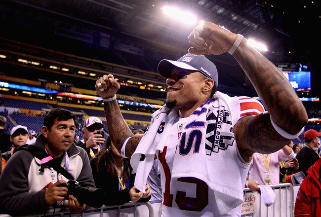 INDIANAPOLIS, IN - FEBRUARY 05:  Devin Thomas #15 of the New York Giants  leaves the field after the Giants defeated the Patriots by a score of 21-17 in Super Bowl XLVI at Lucas Oil Stadium on February 5, 2012 in Indianapolis, Indiana.  (Photo by Elsa/Getty Images)