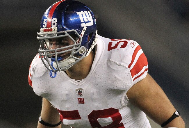 FOXBORO, MA - SEPTEMBER 1:  Mark Herzlich #58 of the New York Giants keeps eyes on the offense during a game against the New England Patriots at Gillette Stadium on September 1, 2011 in Foxboro, Massachusetts. (Photo by Jim Rogash/Getty Images)