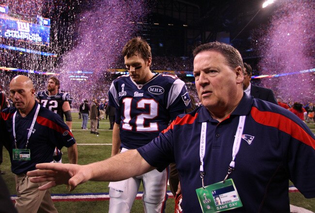 INDIANAPOLIS, IN - FEBRUARY 05:  Tom Brady #12 of the New England Patriots walks off the field after losing to the New York Giants by a score of 21-17 in Super Bowl XLVI at Lucas Oil Stadium on February 5, 2012 in Indianapolis, Indiana.  (Photo by Elsa/Getty Images)