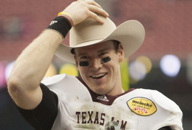 HOUSTON - DECEMBER 31:  Quarterback Ryan Tannehill #17 of Texas A&M Texas A&M Aggies holds his MVP trophy after Texas A&M defeated Northwesten University 33-22 at Reliant Stadium on December 31, 2011 in Houston, Texas.  (Photo by Bob Levey/Getty Images)