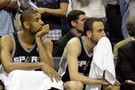 MEMPHIS, TN - APRIL 25: George Hill #3, Tim Duncan #21 and Manu Ginobili #20 of the San Antonio Spurs watch from the bench in the fourth quarter during the game against the Memphis Grizzlies in Game Four of the Western Conference Quarterfinals in the 2011 NBA Playoffs at FedExForum on April 25, 2011 in Memphis, Tennessee. The Grizzlies won 104-86. NOTE TO USER: User expressly acknowledges and agrees that, by downloading and/or using this Photograph, User is consenting to the terms and conditions of the Getty Images License Agreement.  (Photo by Andy Lyons/Getty Images)