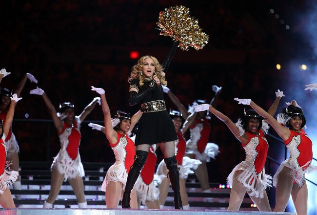 INDIANAPOLIS, IN - FEBRUARY 05:  Singer Madonna performs with M.I.A. and Nicki Minaj during the Bridgestone Super Bowl XLVI Halftime Show at Lucas Oil Stadium on February 5, 2012 in Indianapolis, Indiana.  (Photo by Al Bello/Getty Images)