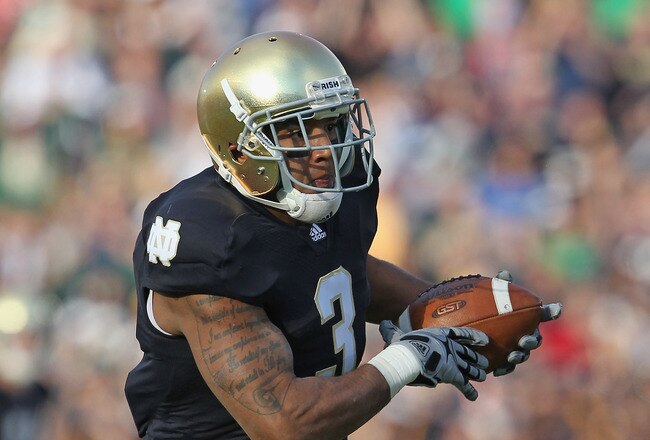 SOUTH BEND, IN - OCTOBER 29:  Michael Floyd#3 of the Notre Dame Fighting Irish runs for a touchdown after catching a pass against the Navy Midshipmen at Notre Dame Stadium on October 29, 2011 in South Bend, Indiana. Notre Dame defeated Navy 56-14.  (Photo by Jonathan Daniel/Getty Images)