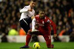 LIVERPOOL, ENGLAND - FEBRUARY 06:  Kyle Walker of Tottenham Hotspur tangles with Glen Johnson of Liverpool during the Barclays Premier League match between Liverpool and Tottenham Hotspur at Anfield on February 6, 2012 in Liverpool, England.  (Photo by Clive Brunskill/Getty Images)
