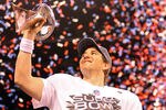 INDIANAPOLIS, IN - FEBRUARY 05:  Quarterback Eli Manning #10 of the New York Giants poses with the Vince Lombardi Trophy after the Giants defeated the Patriots by a score of 21-17 in Super Bowl XLVI at Lucas Oil Stadium on February 5, 2012 in Indianapolis, Indiana.  (Photo by Ezra Shaw/Getty Images)