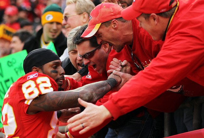 KANSAS CITY, MO - DECEMBER 18:  Dwayne Bowe #82 of the Kansas City Chiefs celebrates by jumping into the standfs after the Chiefs defeated the Green Bay Packers 19-14 to win the game on December 18, 2011 at Arrowhead Stadium in Kansas City, Missouri.  (Photo by Jamie Squire/Getty Images)