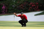 AUGUSTA, GA - APRIL 10:  Tiger Woods lines up a putt on the 13th hole during the final round of the 2011 Masters Tournament at Augusta National Golf Club on April 10, 2011 in Augusta, Georgia.  (Photo by Harry How/Getty Images)
