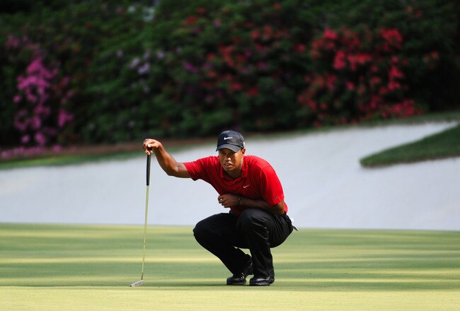 AUGUSTA, GA - APRIL 10:  Tiger Woods lines up a putt on the 13th hole during the final round of the 2011 Masters Tournament at Augusta National Golf Club on April 10, 2011 in Augusta, Georgia.  (Photo by Harry How/Getty Images)