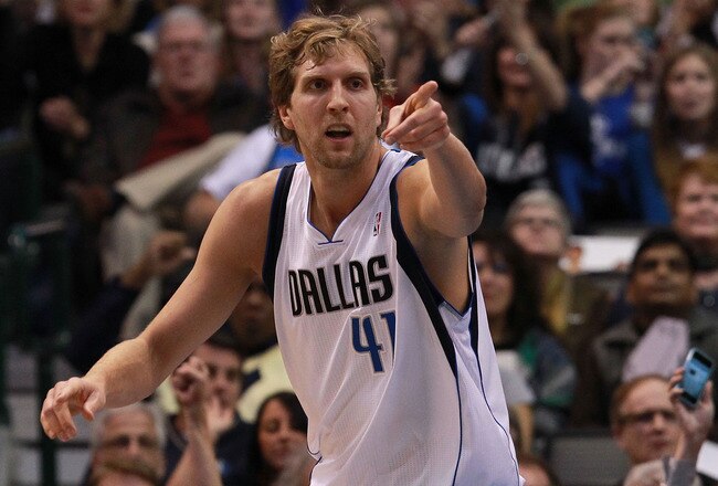 DALLAS, TX - JANUARY 04:  Dirk Nowitzki #41 of the Dallas Mavericks reacts after scoring against the Phoenix Suns at American Airlines Center on January 4, 2012 in Dallas, Texas. Nowitzki was playing in his 1,000 career game.  NOTE TO USER: User expressly acknowledges and agrees that, by downloading and/or using this Photograph, user is consenting to the terms and conditions of the Getty Images License Agreement.  (Photo by Ronald Martinez/Getty Images)
