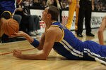 CHICAGO - NOVEMBER 11: Andris Biedrins #15 of the Golden State Warriors hands the ball off to a teammate after a scramble on the floor against the Chicago Bulls at the United Center on November 11, 2010 in Chicago, Illinois. NOTE TO USER: User expressly acknowledges and agrees that, by downloading and/or using this Photograph, User is consenting to the terms and conditions of the Getty Images License Agreement. (Photo by Jonathan Daniel/Getty Images)