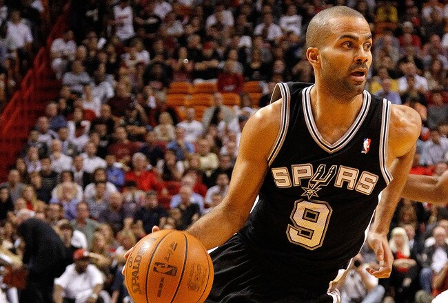 MIAMI, FL - JANUARY 17:  Tony Parker #9 of the San Antonio Spurs drives to the basket during a game against the Miami Heat at American Airlines Arena on January 17, 2012 in Miami, Florida. NOTE TO USER: User expressly acknowledges and agrees that, by downloading and/or using this Photograph, User is consenting to the terms and conditions of the Getty Images License Agreement.  (Photo by Mike Ehrmann/Getty Images)