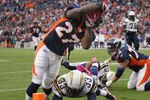 DENVER, CO - OCTOBER 09:  Running back Knowshon Moreno #27 of the Denver Broncos dives over Dante Hughes #33 of the San Diego Chargers for a touchdown at Sports Authority Field at Mile High on October 9, 2011 in Denver, Colorado. The Chargers defeated the Broncos 29-24.  (Photo by Doug Pensinger/Getty Images)