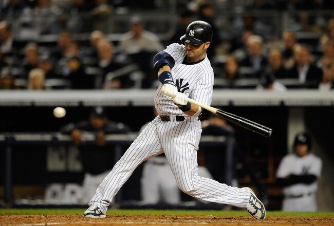 NEW YORK, NY - OCTOBER 06:  Nick Swisher #33 of the New York Yankees steps up to the plate to bat against the Detroit Tigers during Game Five of the American League Championship Series at Yankee Stadium on October 6, 2011 in the Bronx borough of New York City.  (Photo by Patrick McDermott/Getty Images)