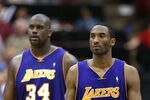 MINNEAPOLIS - MAY 29:  Kobe Bryant #8 and Shaquille O'Neal #34 of the Los Angeles Lakers walk upcourt in the fourth quarter of Game five of the Western Conference Finals against the Minnesota Timberwolves during the 2004 NBA Playoffs on May 29, 2004 at Target Center in Minneapolis, Minnesota.  NOTE TO USER: User expressly acknowledges and agrees that, by downloading and or using this photograph, User is consenting to the terms and conditions of the Getty Images License Agreement.  (Photo by Jed Jacobsohn/Getty Images)