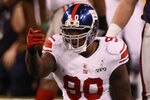 INDIANAPOLIS, IN - FEBRUARY 05:  Jason Pierre-Paul #90 of the New York Giants celebrates a play during the first half against the New England Patriots during Super Bowl XLVI at Lucas Oil Stadium on February 5, 2012 in Indianapolis, Indiana.  (Photo by Win McNamee/Getty Images)