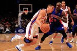 NEW YORK, NY - JANUARY 31:  Jeremy Lin #17 of the New York Knicks drives past Detroit Pistons Walker Russell #23 of the Detroit Pistons at Madison Square Garden on January 31, 2012 in New York City.  NOTE TO USER: User expressly acknowledges and agrees that, by downloading and or using this photograph, User is consenting to the terms and conditions of the Getty Images License Agreement. (Photo by Chris Trotman/Getty Images)