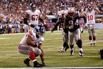 INDIANAPOLIS, IN - FEBRUARY 05:  Fullback Ahmad Bradshaw #44 of the New York Giants scores on a six-yard touchdown run in the fourth quarter against the New England Patriots during Super Bowl XLVI at Lucas Oil Stadium on February 5, 2012 in Indianapolis, Indiana.  (Photo by Rob Carr/Getty Images)